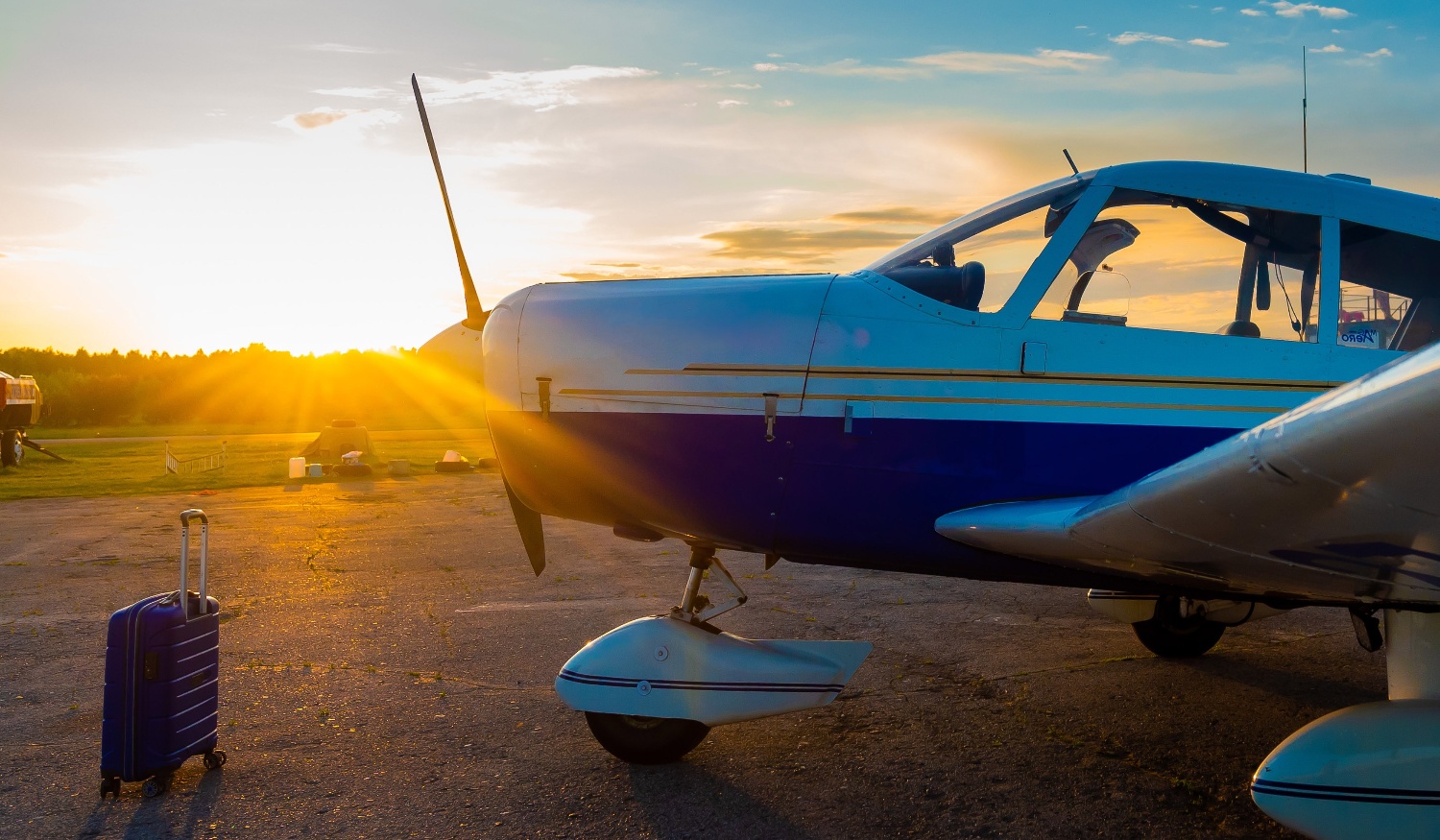 Airplane on ramp with sunrise.