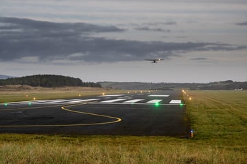 Plane landing on runway