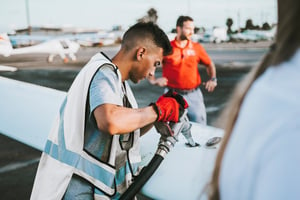 Line crew fueling airplane on the flight line