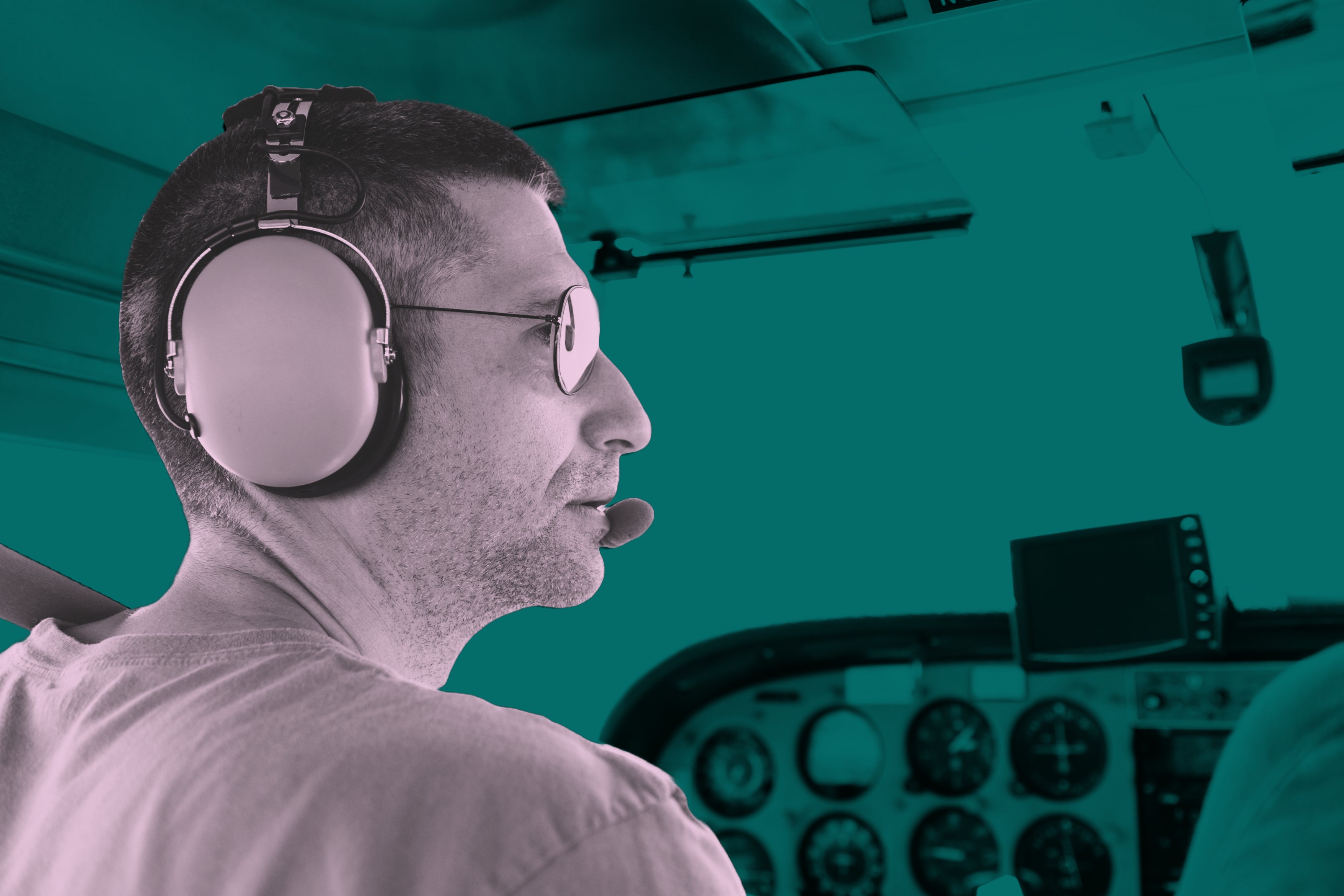Pilot wearing aviation headset in flight