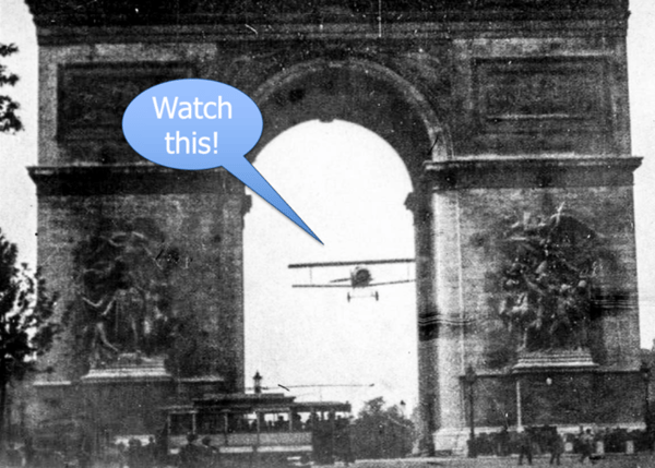 Plane flying under L'Arc de Triomphe