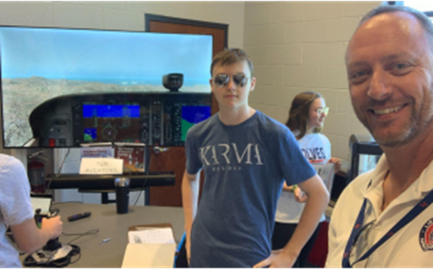Student helps with aviator club
