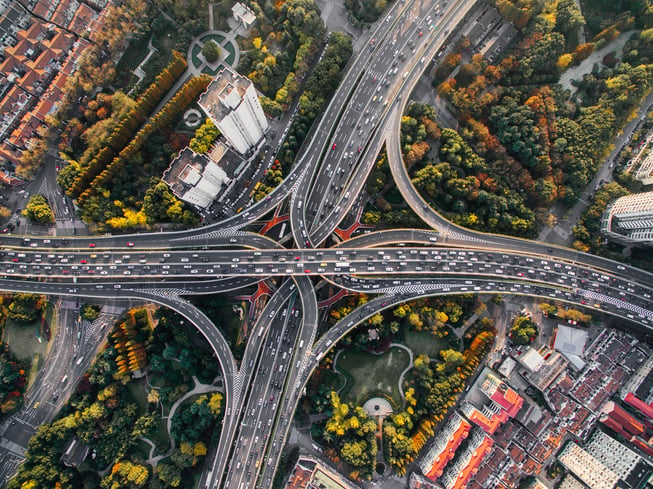 An aerial view of traffic below in a major metropolitan city