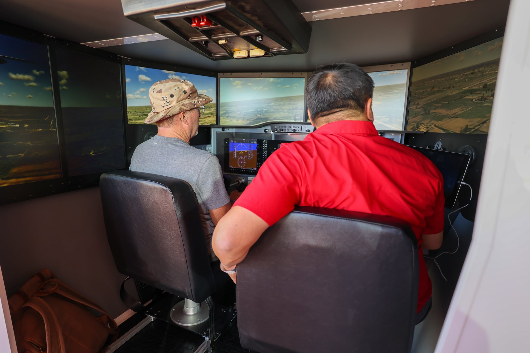 CFI and pilot flying a Redbird AATD