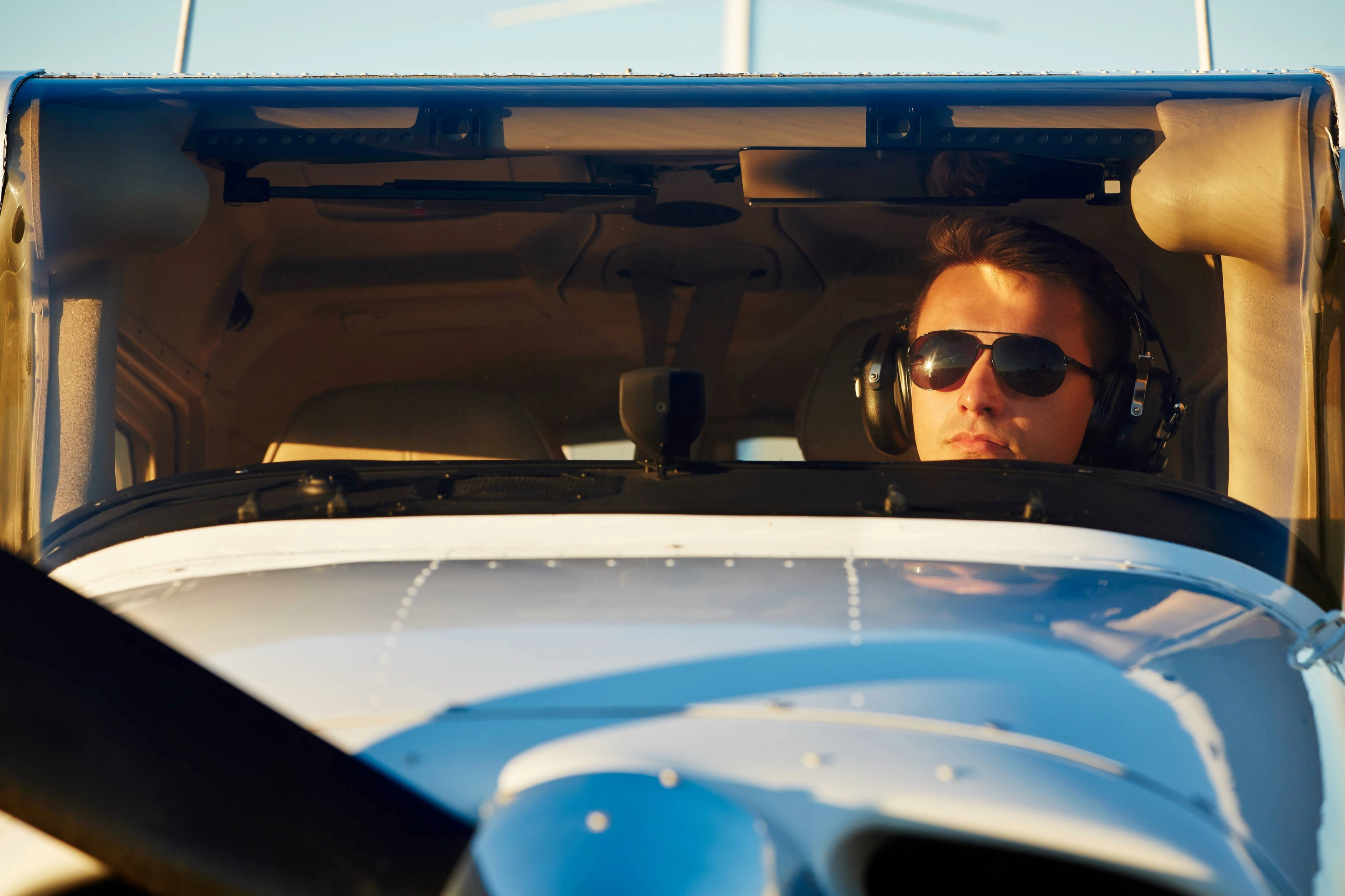 Young pilot taxiing out in single-engine airplane