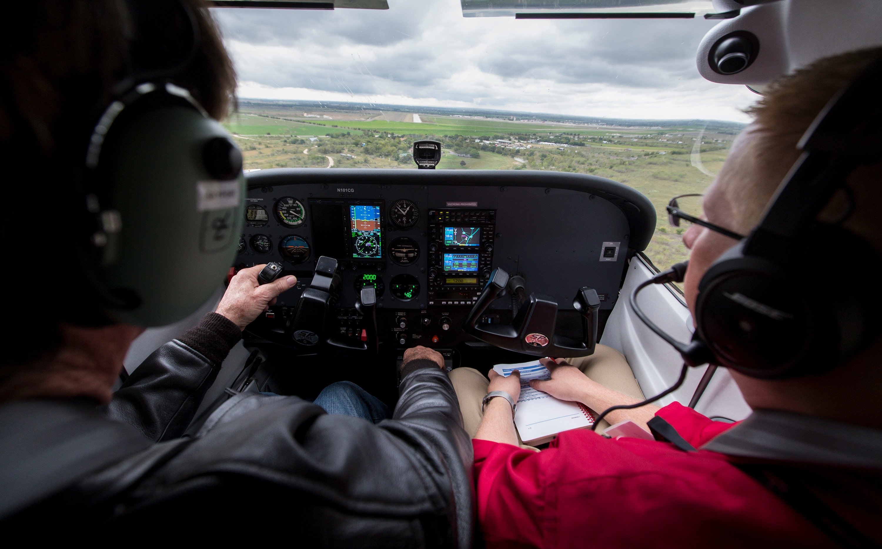 A pilot and flight instructor on final