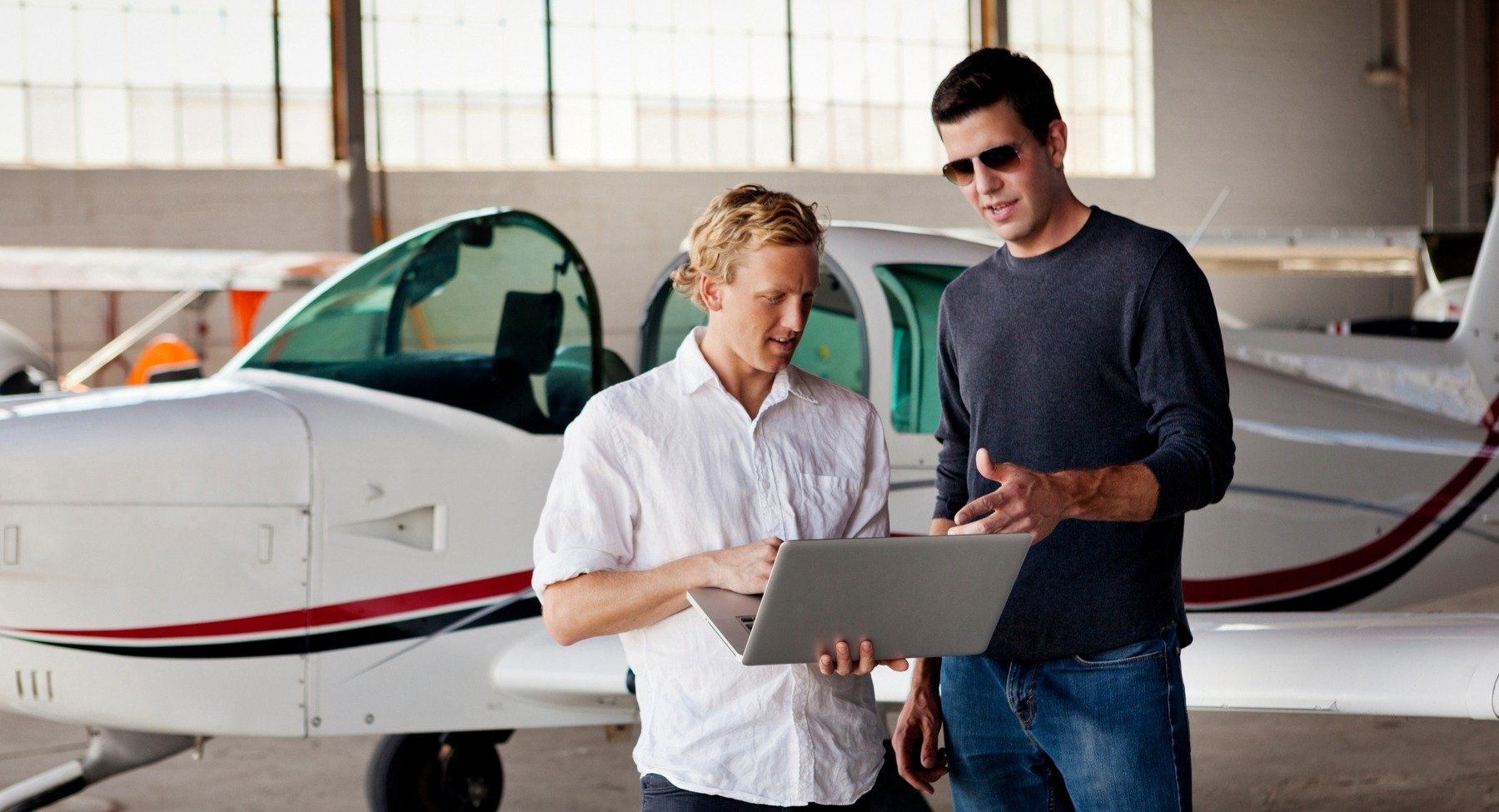 Seller going over airplane specifics with buyer