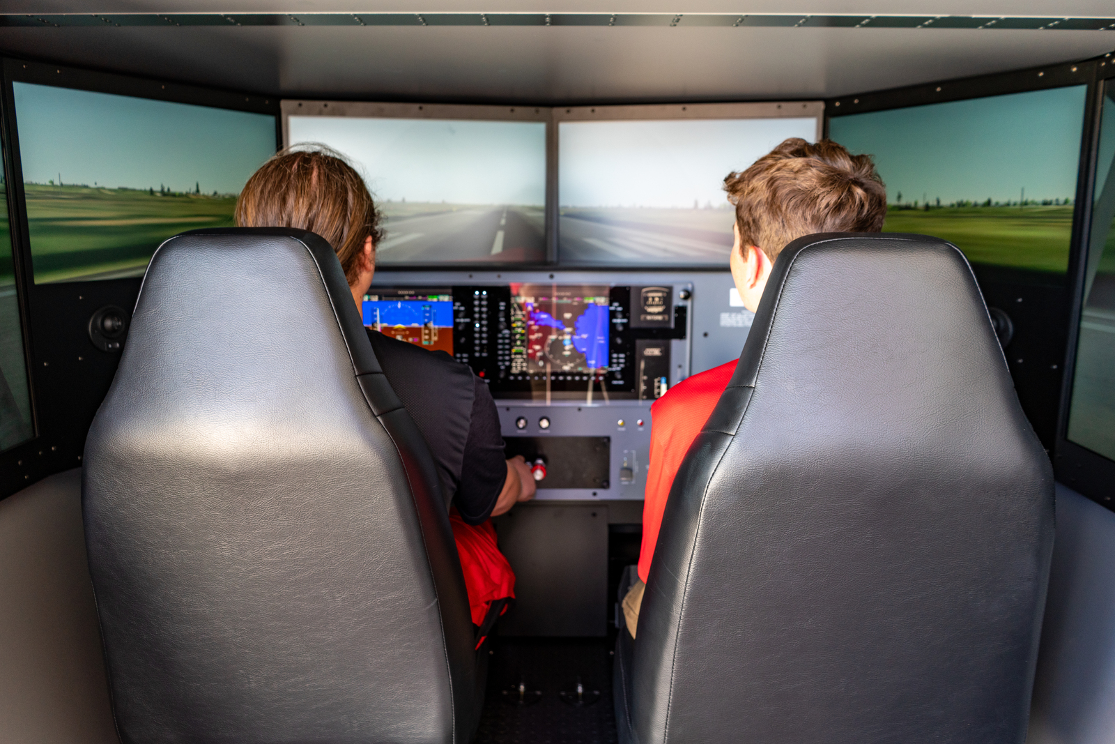 CFI and student in a flight simulator session during a discovery flight