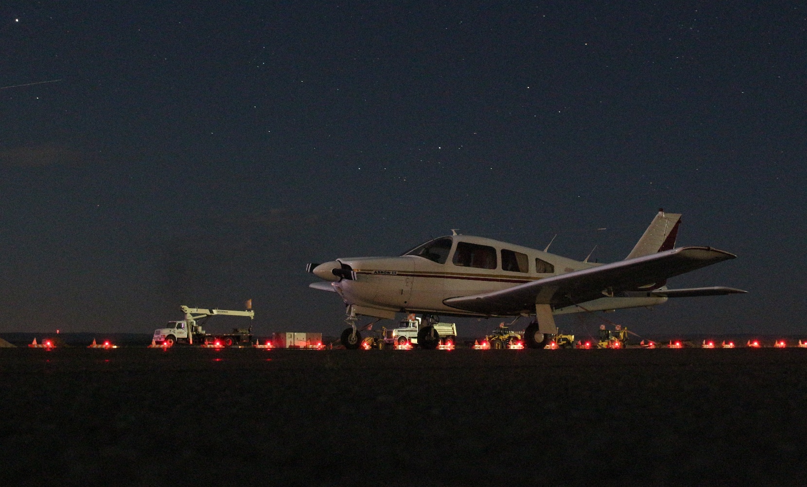 GA airplane on the tarmac at night