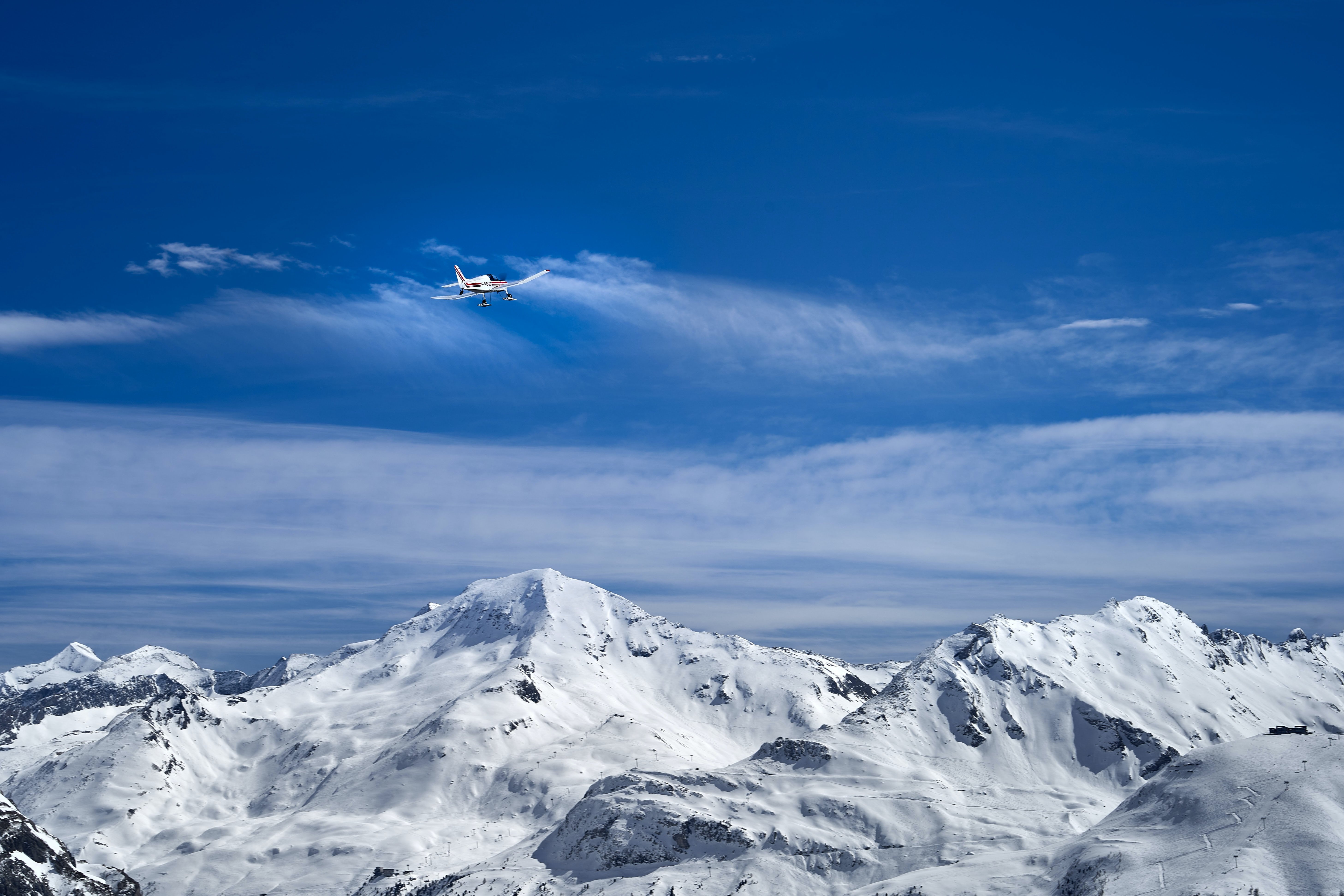 Flying over the mountains in winter