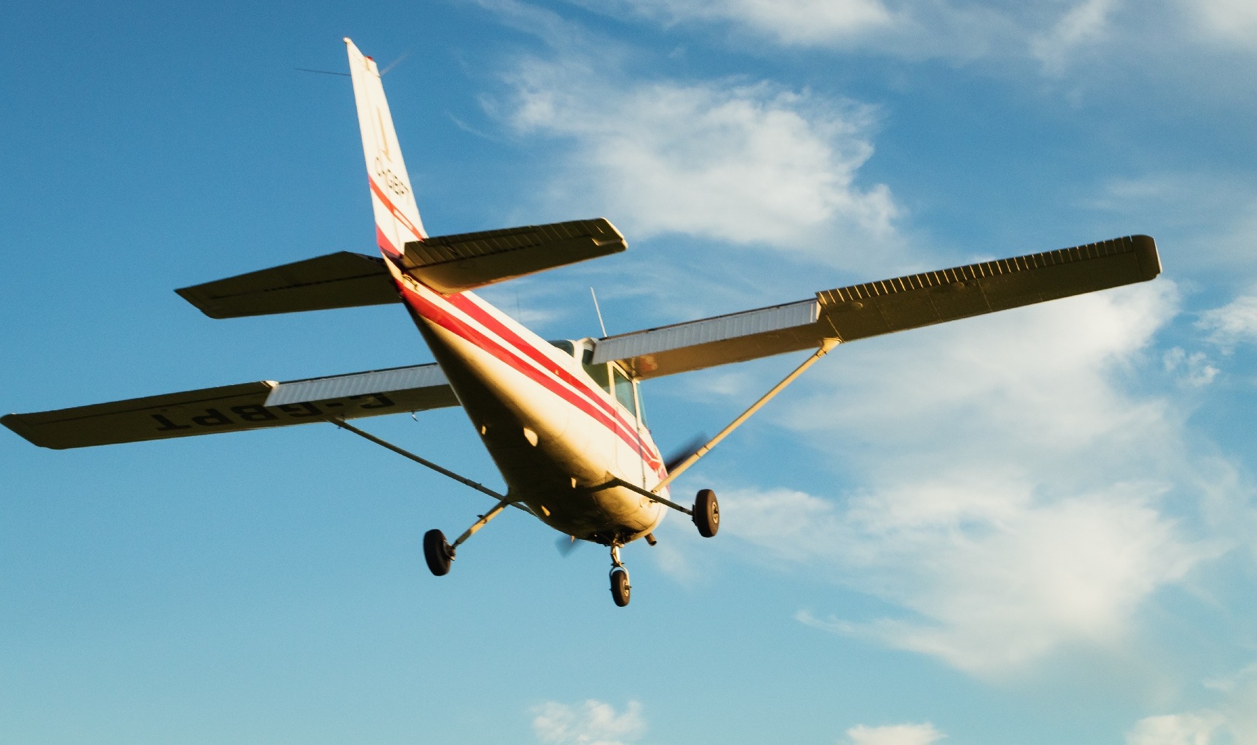 General aviation plane flying in a blue sky