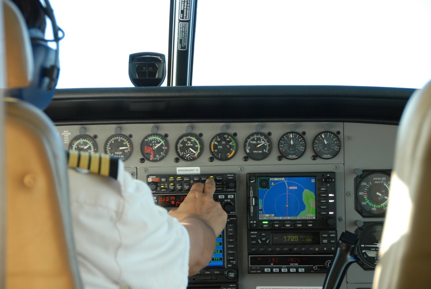 Pilot sitting in the cockpit of a plane