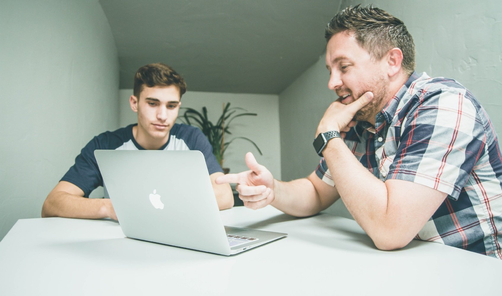 Flight Instructor and Student Using Computer