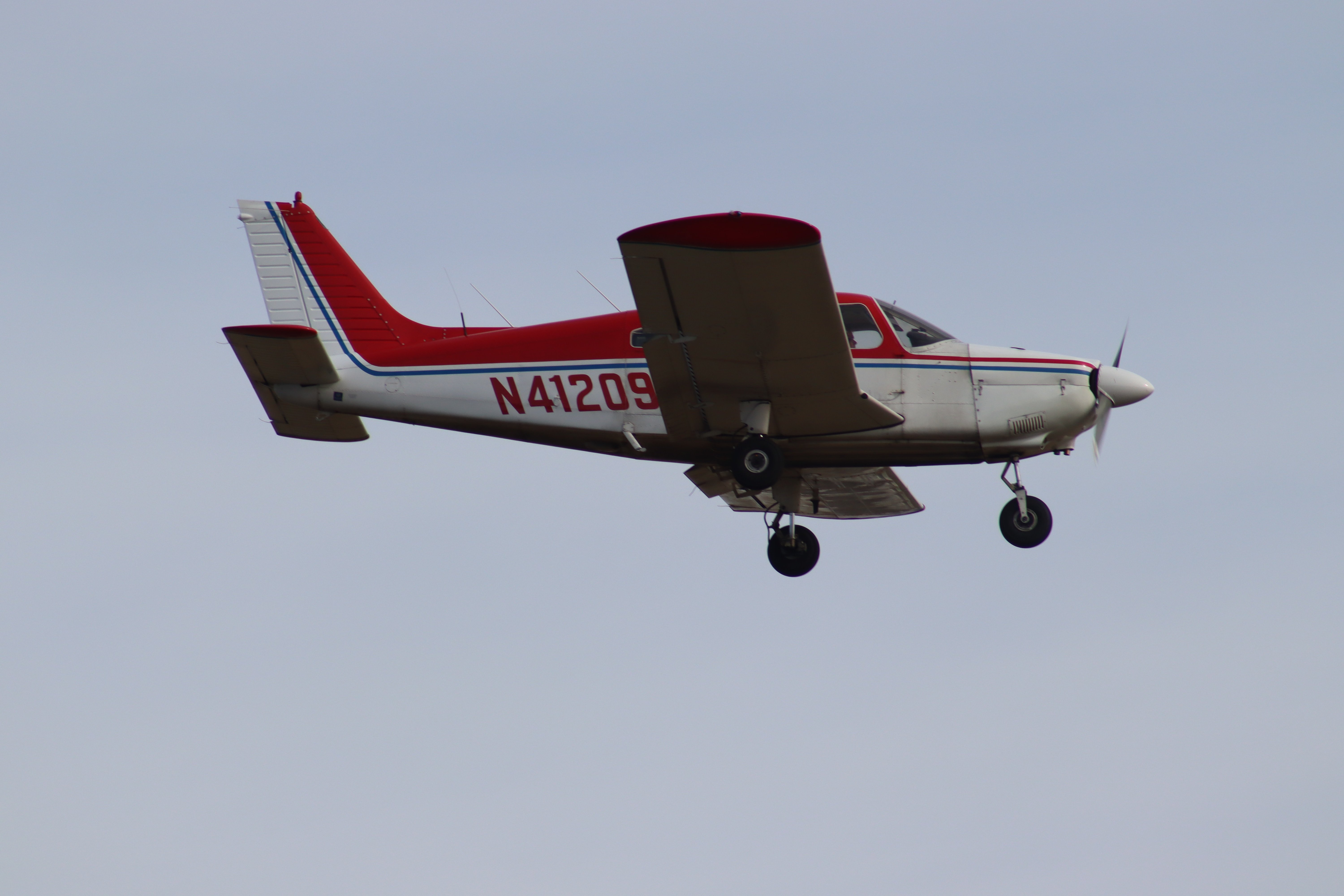 GA airplane with gear down on final